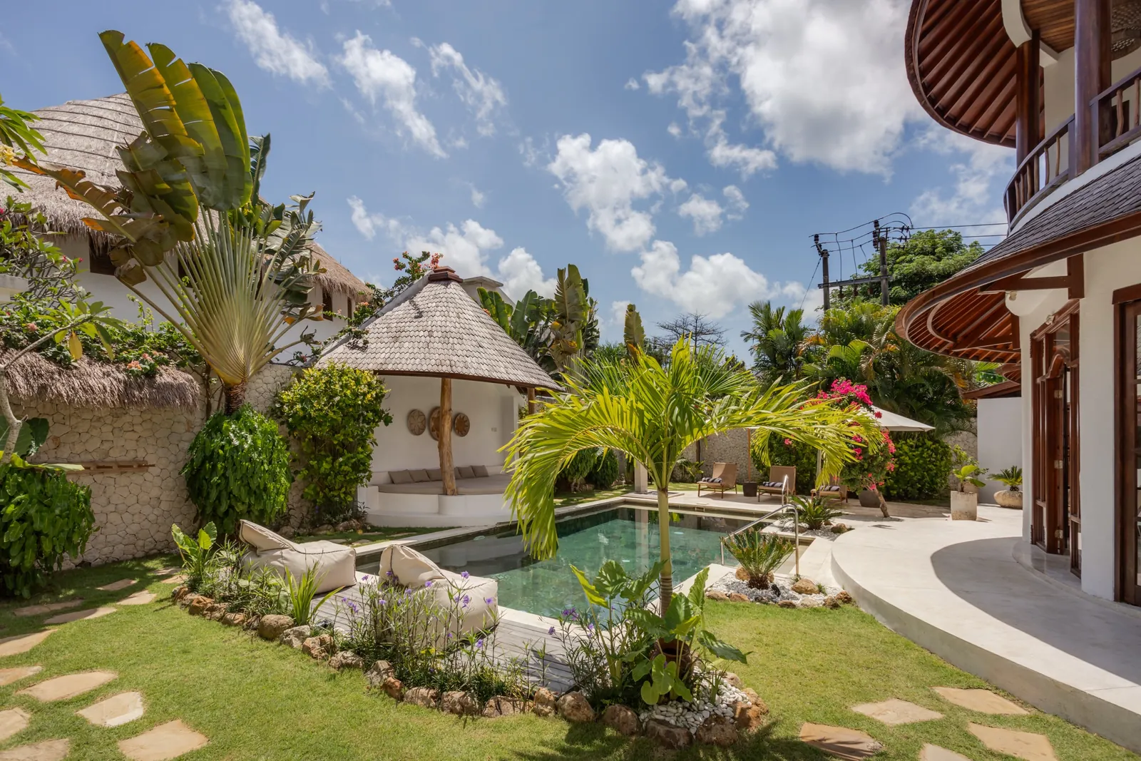 The Madu Bungalow Bingin compound viewed from the garden, midday