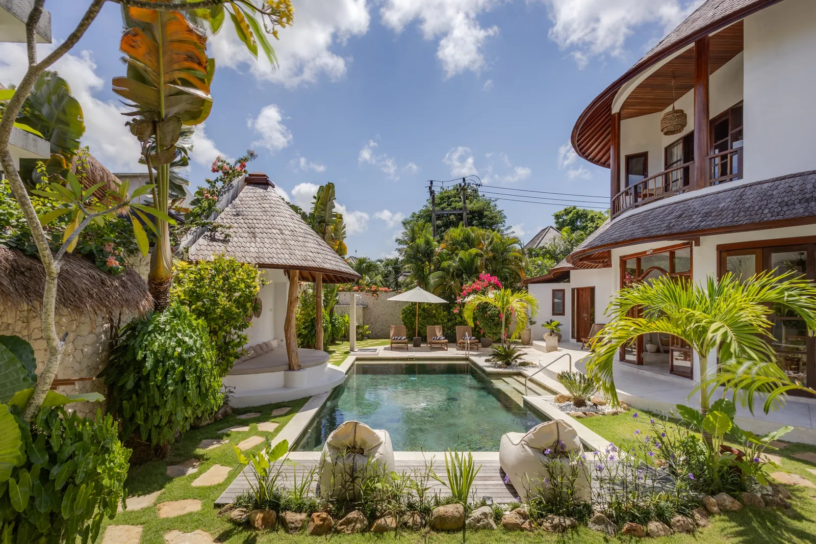 The pool at Madu Bungalow Bingin, looking the length of the compound, midday